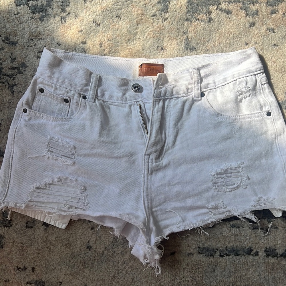 Ripped white shorts